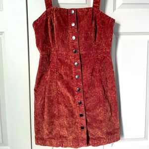 A maroon red button up dress.